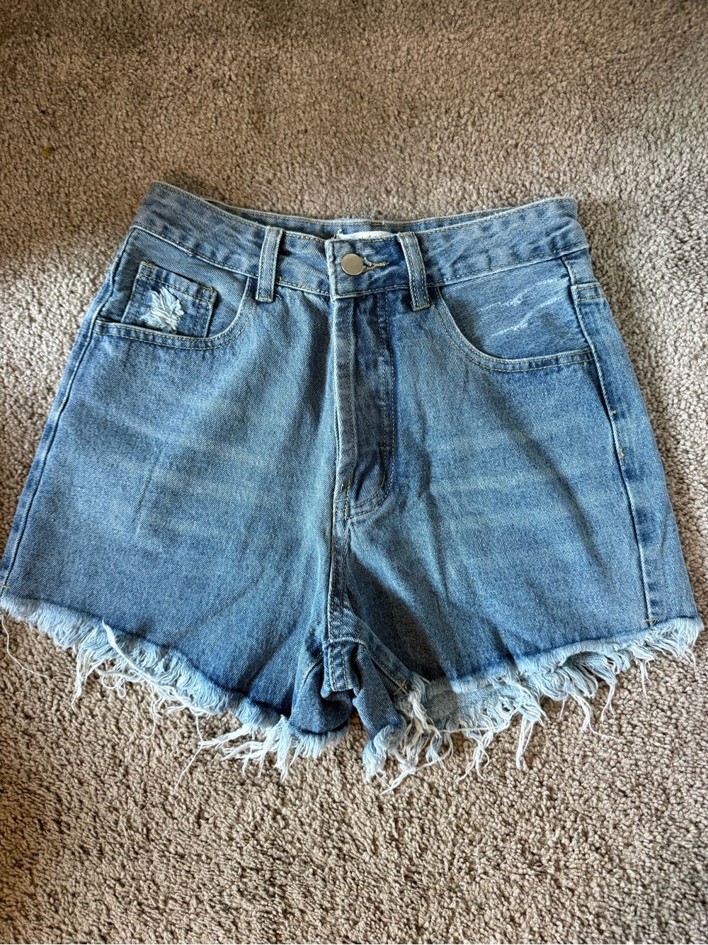High-Rise Light Blue Denim Cutoff Shorts with Frayed Hem